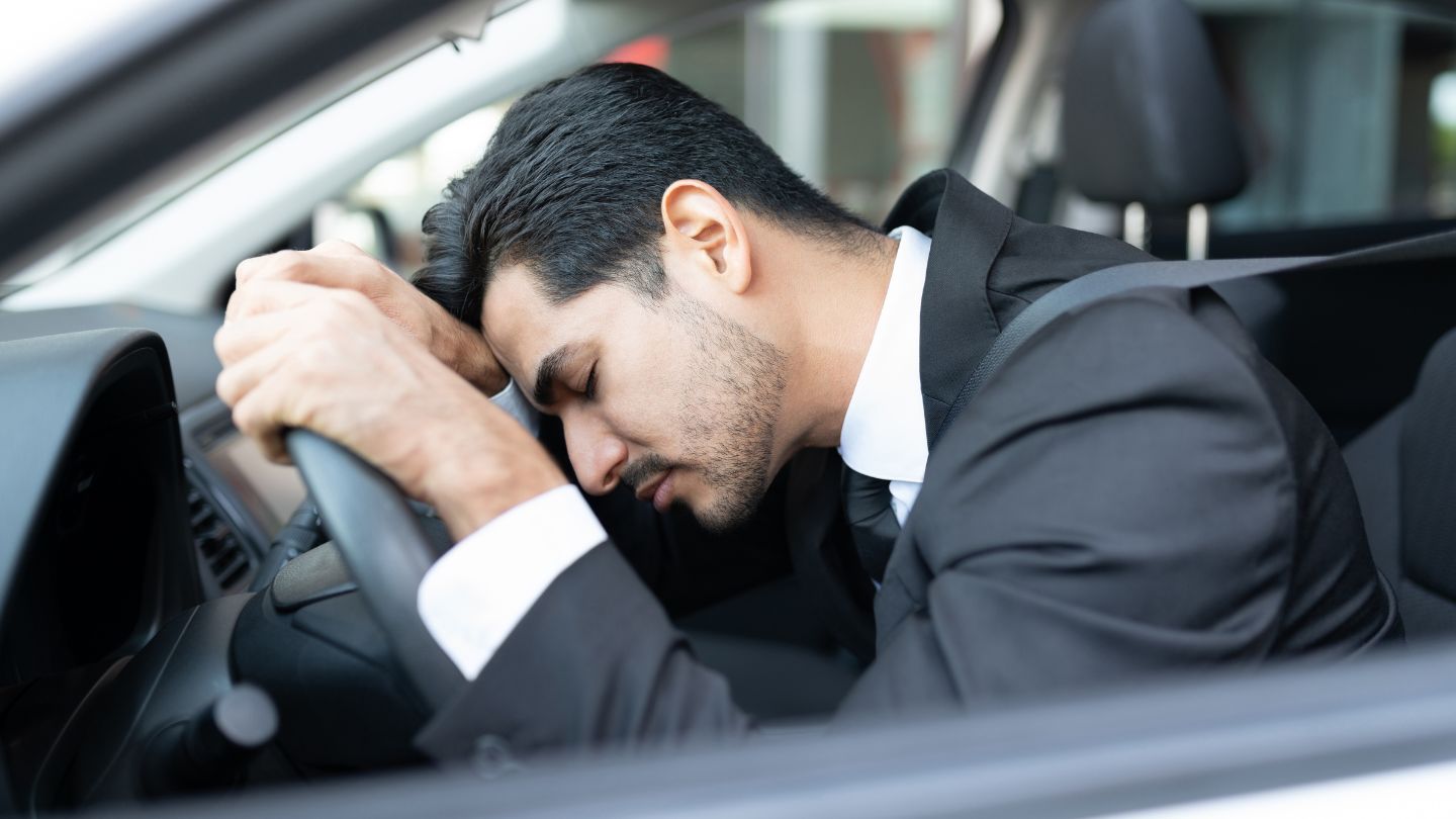 Man Feeling Exhausted While Sitting In A Car